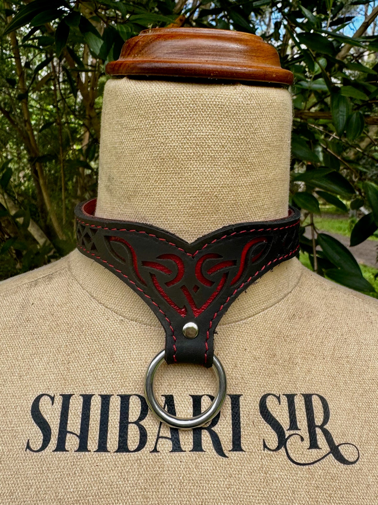 Celtic collar- metallic red with red stitching, black leather.