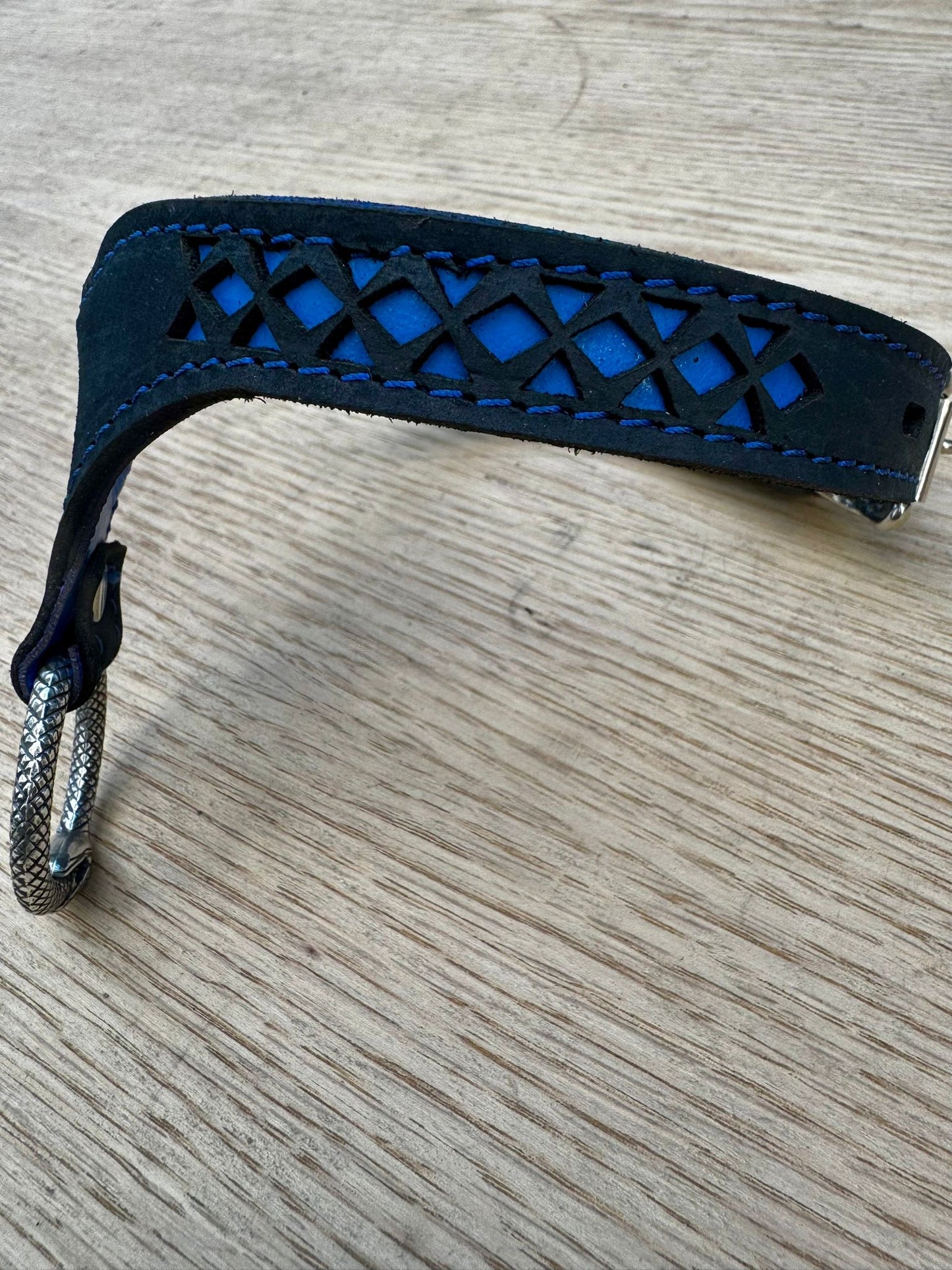Nordic collar- blue backing with blue stitching, black leather. Ouroboros ring