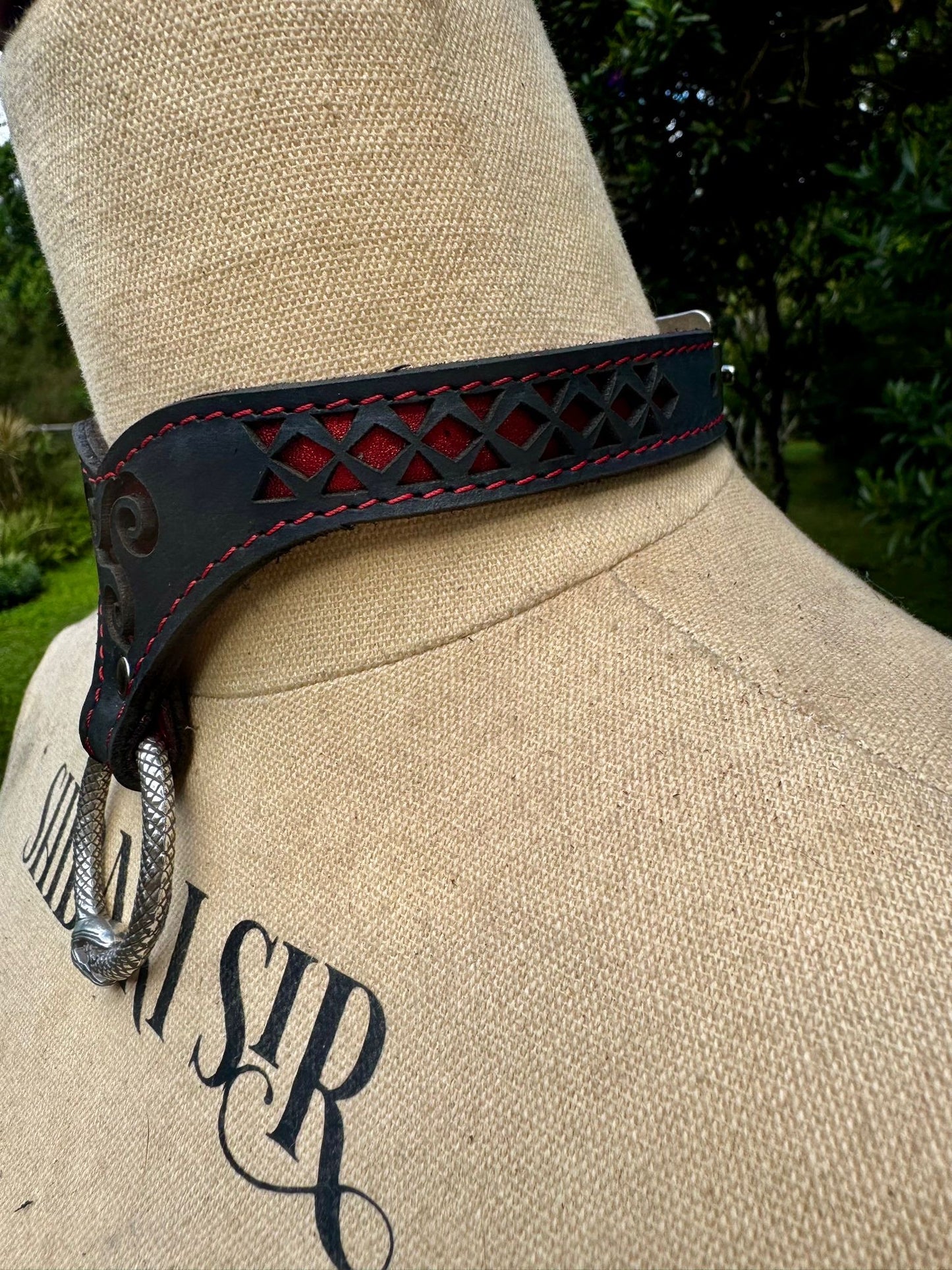 Triskelion collar-  crimson metallic red with red stitching, black leather. Ouroboros ring