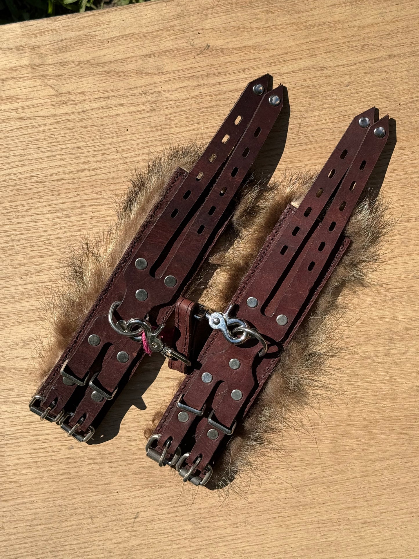 Raccoon fur lined padded kink cuffs ( a pair) on sale. Reduced to $145