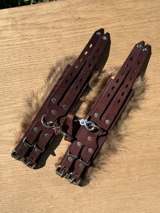 Raccoon fur lined padded kink cuffs ( a pair) on sale. Reduced to $145