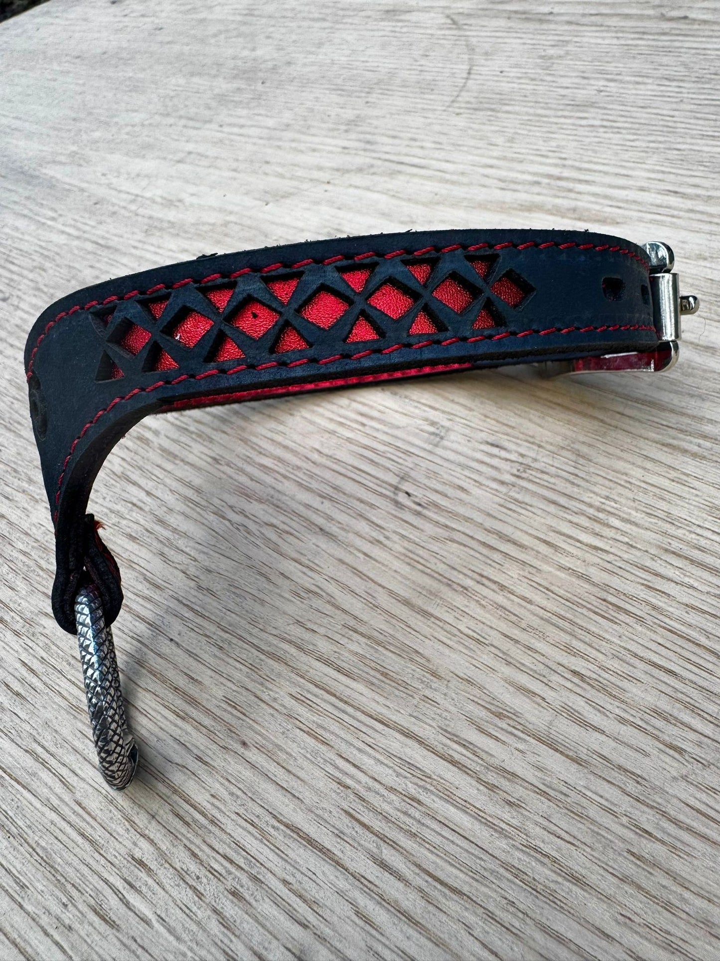 Triskelion collar-  crimson metallic red with red stitching, black leather. Ouroboros ring