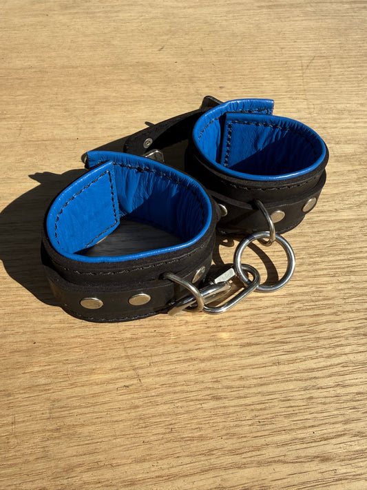 Solid single strap blue padded kink cuffs ( a pair ) on sale. Reduced to $115
