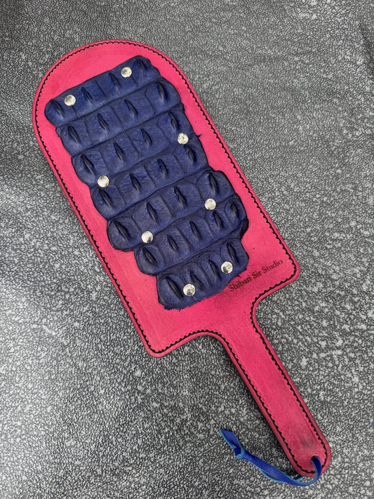 Pink paddle with blue crocodile