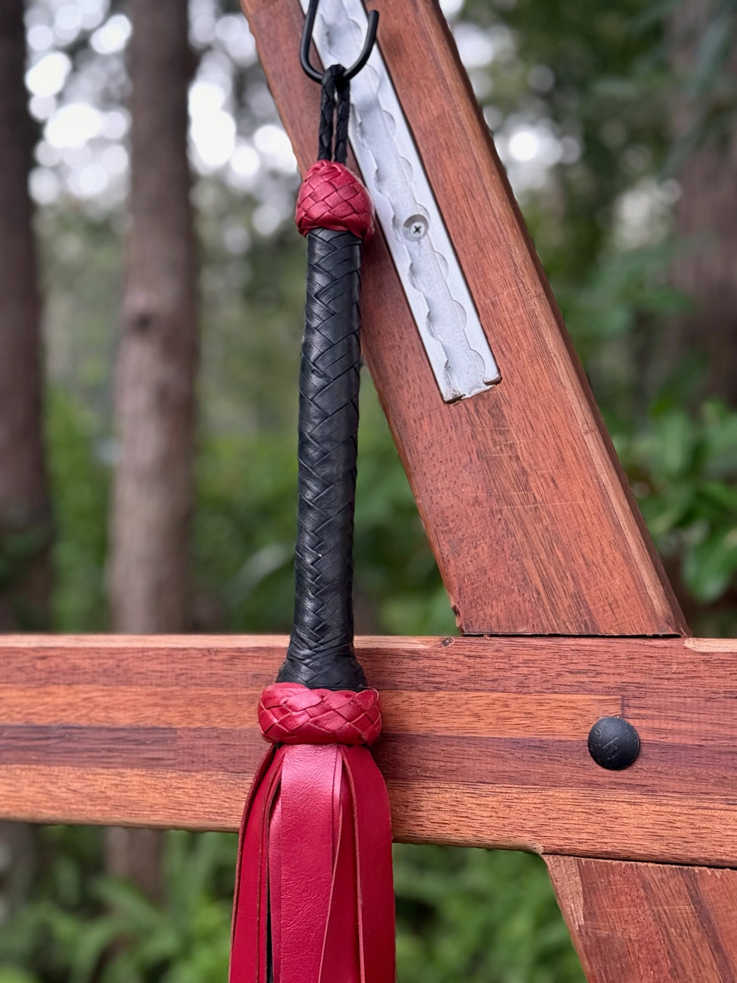 Extra long heavy weight red metalic flogger