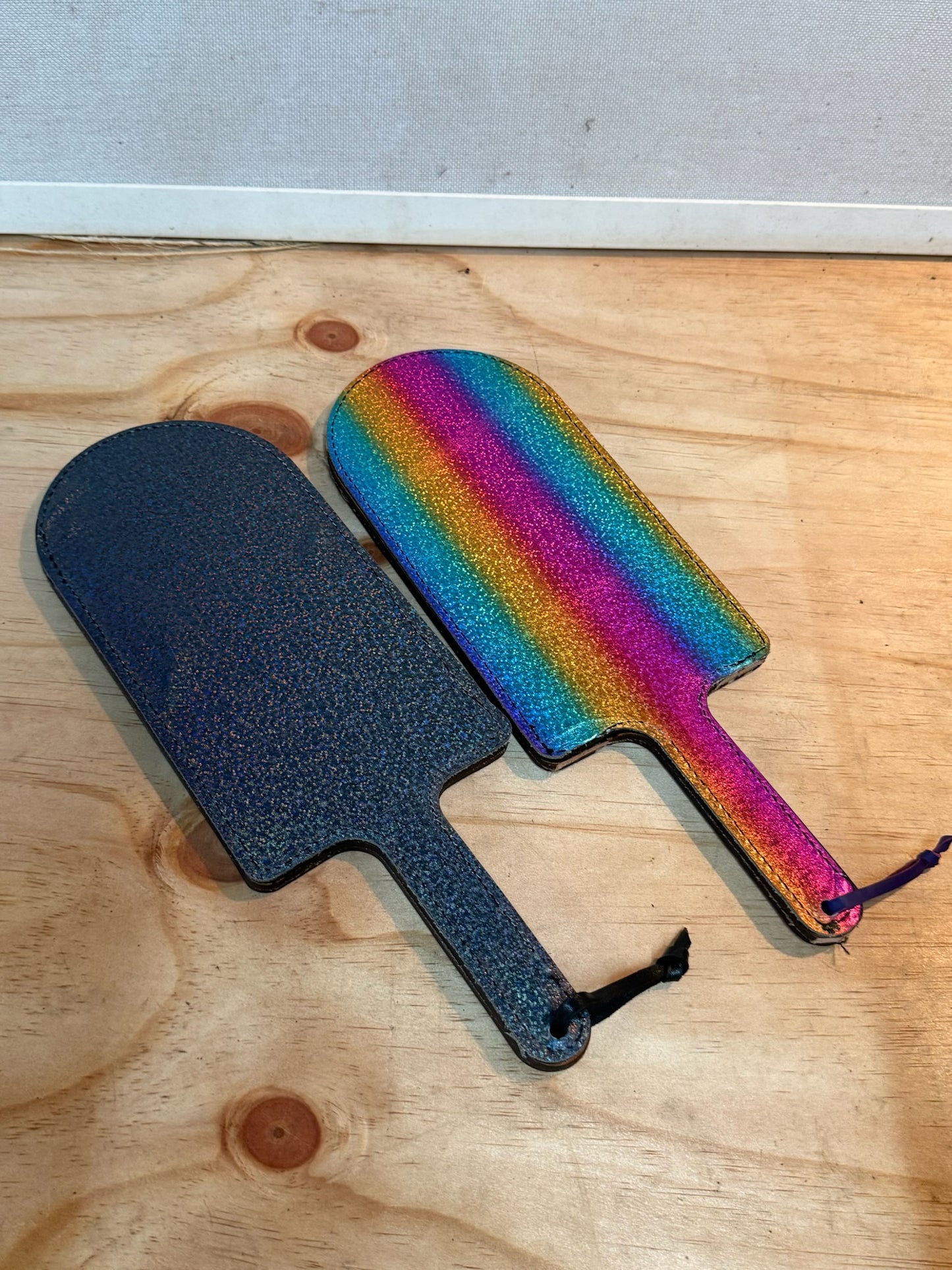 Pink doramon paddle with metalic rainbow backing