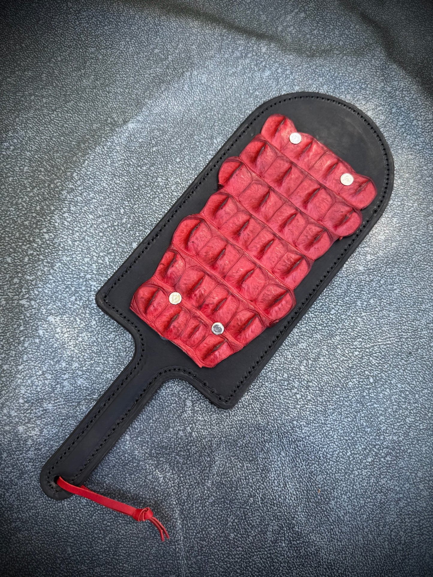 Red paddle with red crocodile